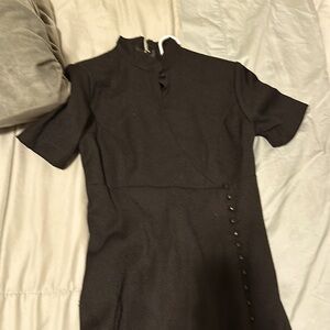 Full length dress with button detail running from waist toolr. Slit up to knee.